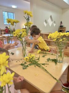 Children learning with flowers.
